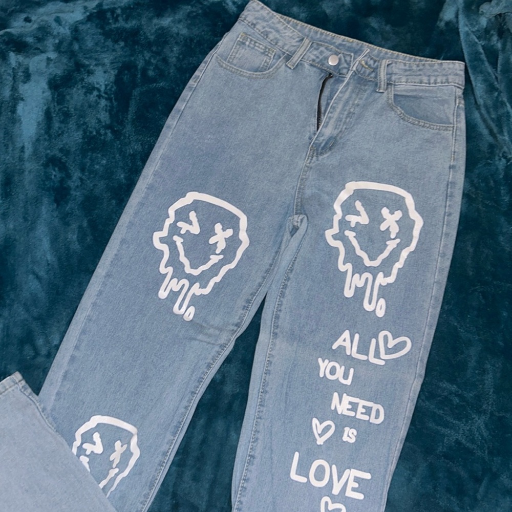Oversized pants with writing “all you need is love”. Size small